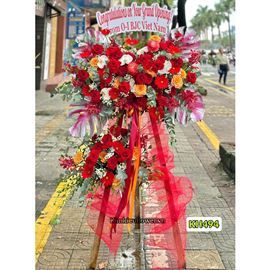 Kệ hoa chúc mừng tone đỏ cam mix lan hồ điệp - KH494